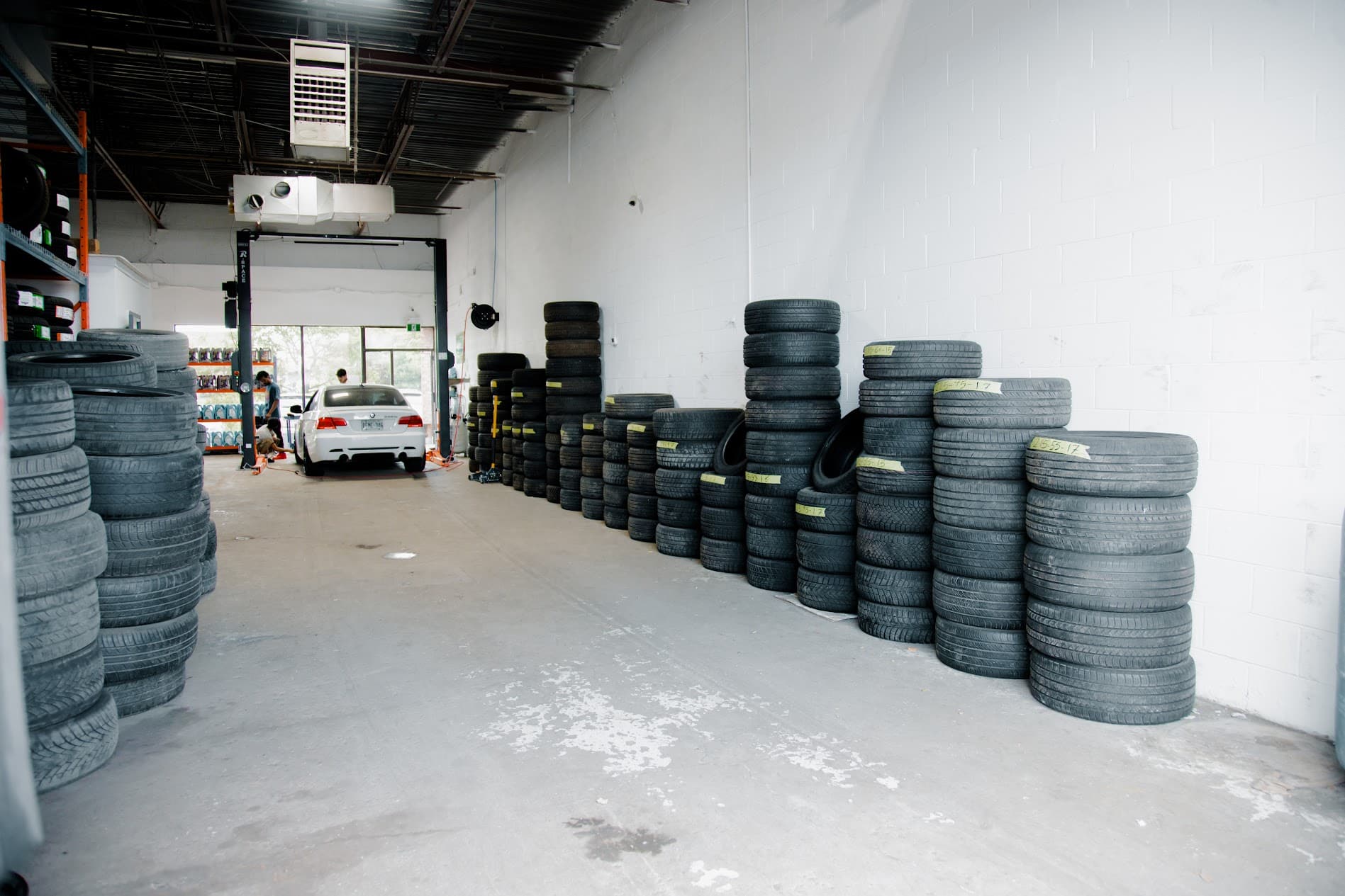 Organized inventory staging with categorized tire sizing for rapid installation