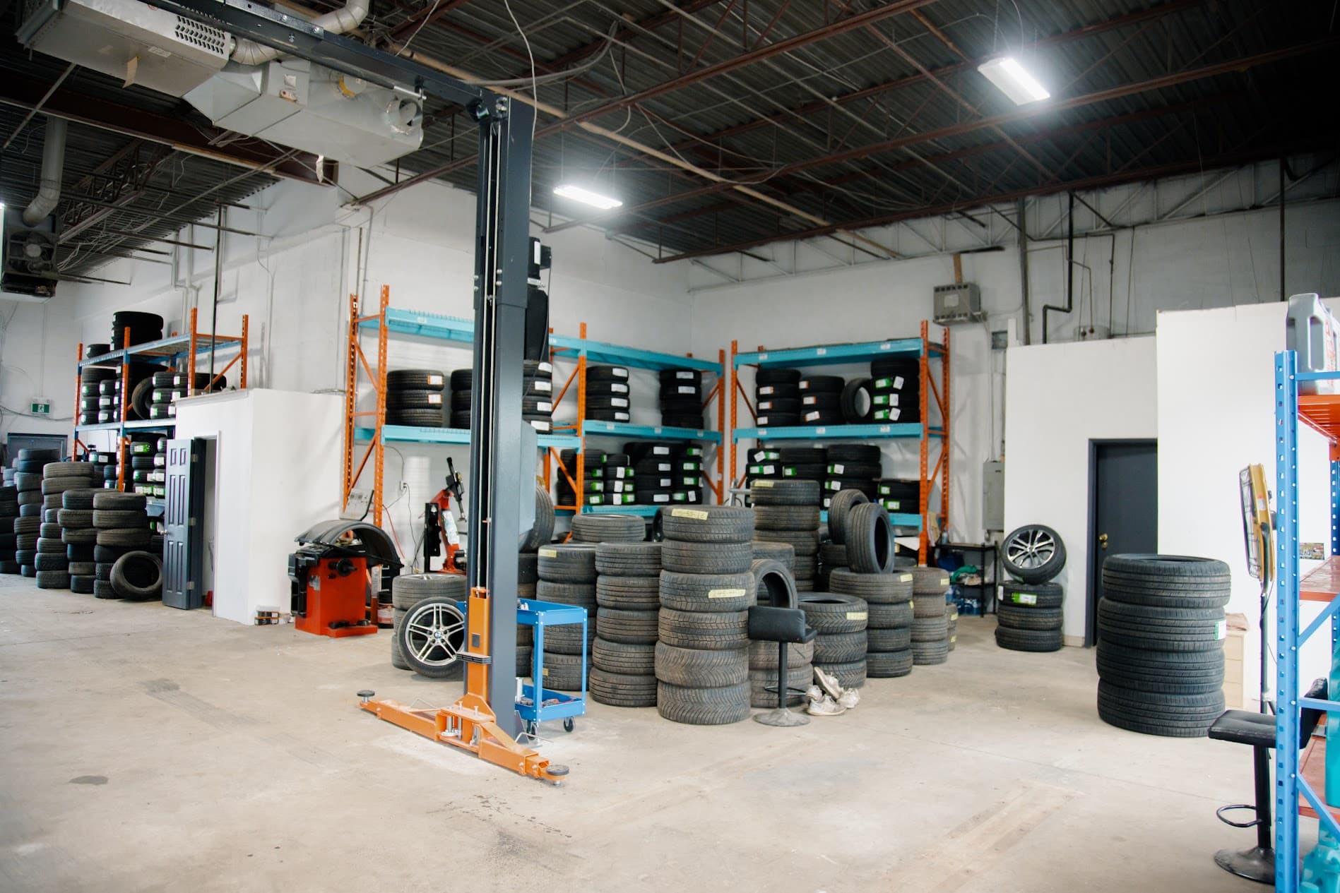 Spacious main shop floor equipped with heavy vehicle lifts and tooling